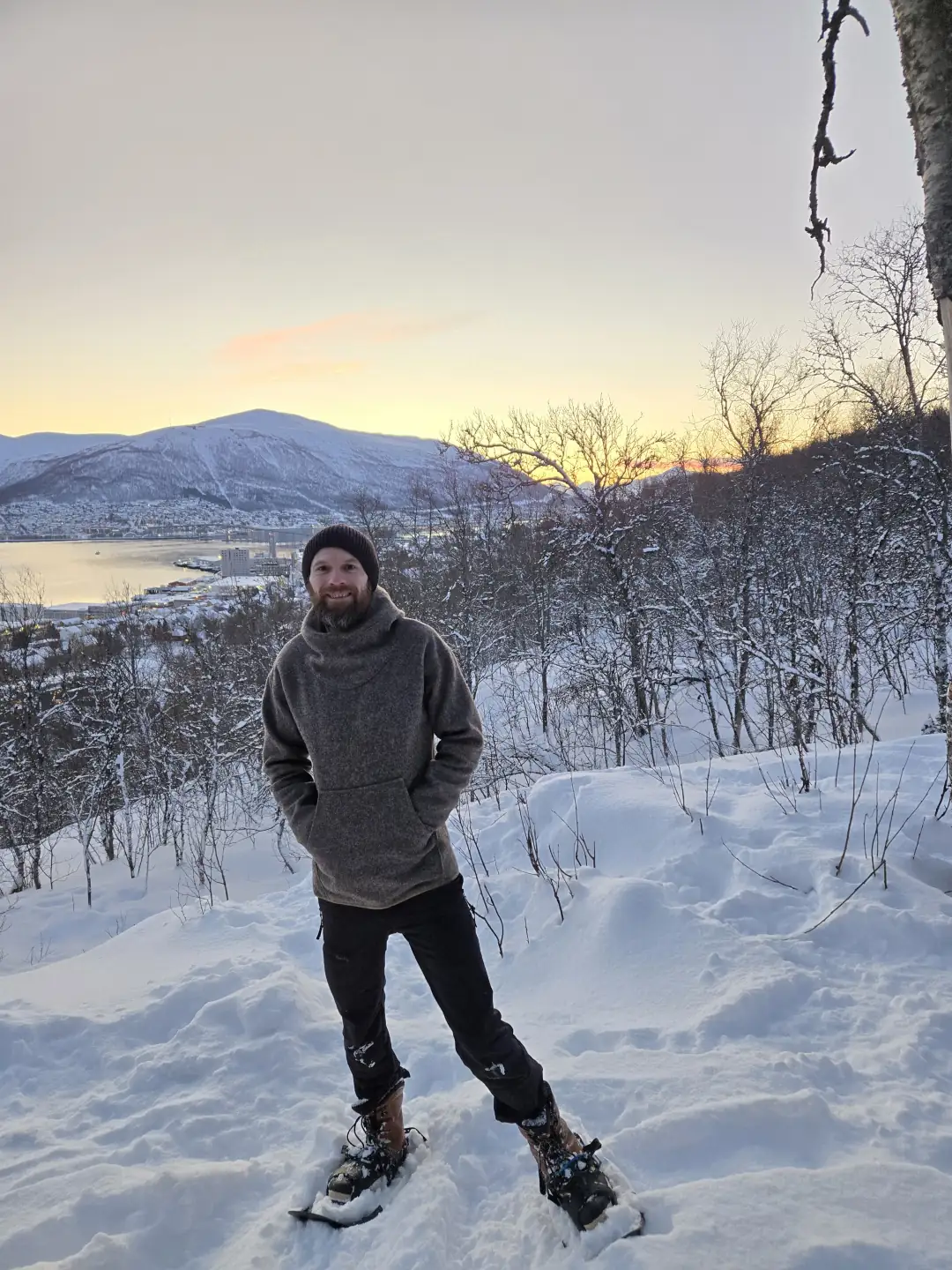 Alex wearing snowshoes on a guided winter tour
