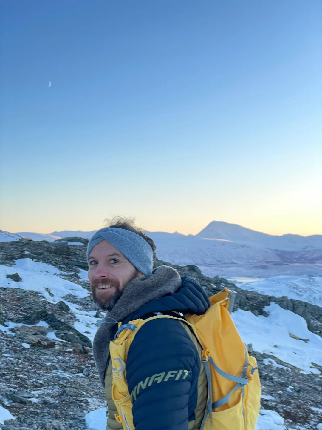 Alexander Lewang – German Tour Guide from Lofoten Lux Tours hiking in the Arctic landscape of Lofoten